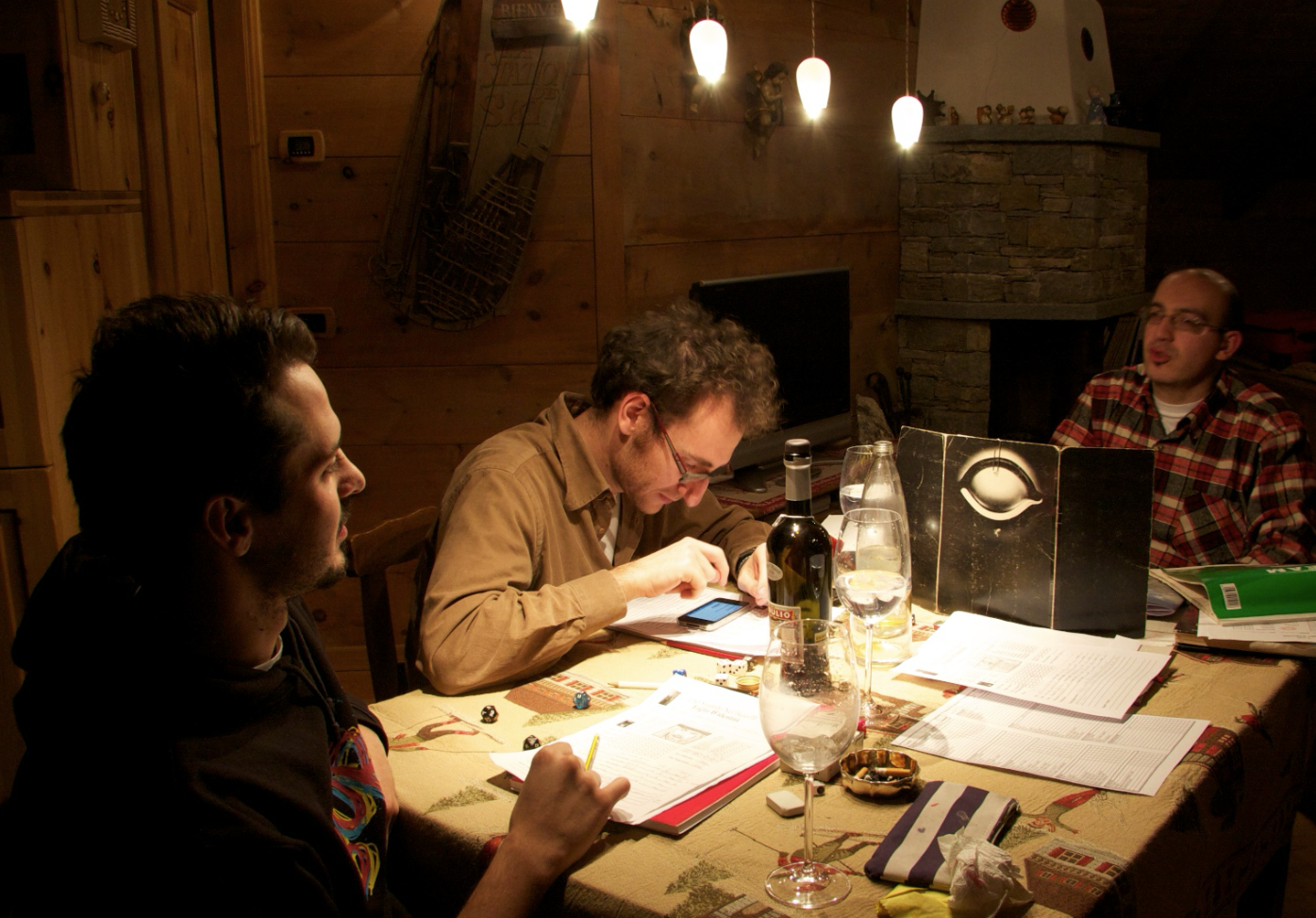 Friends playing tabletop RPGs together around a table